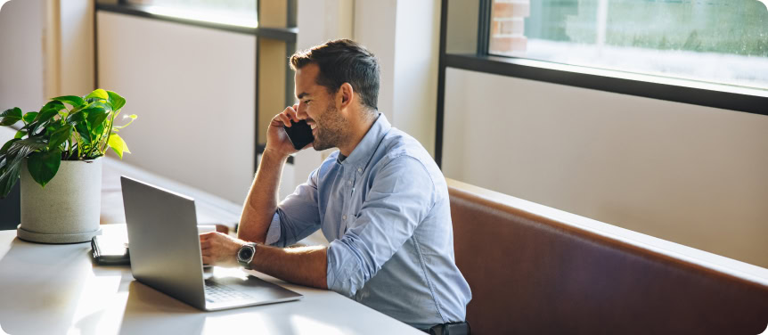 male professional on a call with his national seo agency