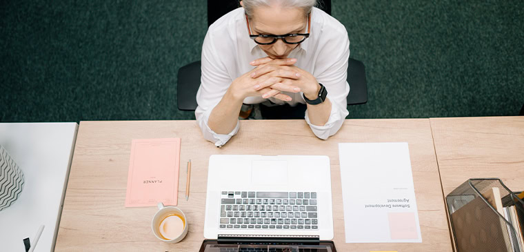 woman reads the audit findings from her technical SEO agency