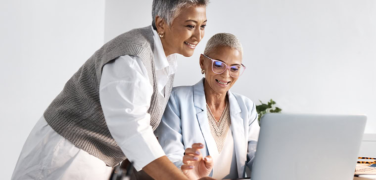 two coworkers happy with search visibility improvements because of technical seo services